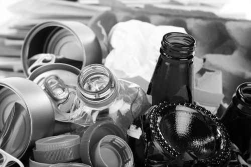 Front view of a Dulwich street with a house clearance van parked outside, workers preparing items.